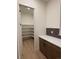Pantry room with a white marble-top counter and multiple storage shelves at 5621 W 141St Ln, Broomfield, CO 80020
