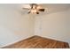 Bedroom featuring hardwood floors, ceiling fan and white door at 1182 N Clermont St # 101, Denver, CO 80220