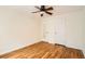 Bedroom featuring hardwood floors, ceiling fan, white trim and closet doors at 1182 N Clermont St # 101, Denver, CO 80220