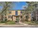 Two-story brick apartment building with mature landscaping in front at 1182 N Clermont St # 101, Denver, CO 80220