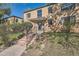 Two-story brick apartment building with mature landscaping in front at 1182 N Clermont St # 101, Denver, CO 80220
