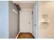 Entryway with hardwood floors, coat rack, and storage shelf at 1182 N Clermont St # 101, Denver, CO 80220