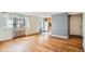 Living room with hardwood floors leading to an open kitchen space at 1182 N Clermont St # 101, Denver, CO 80220