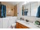Bathroom featuring a tub, a vanity with a sink, and modern tile at 9385 E Center Ave # 1D, Denver, CO 80247