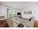 Inviting living room with a balcony view, modern furniture, and light walls at 9385 E Center Ave # 1D, Denver, CO 80247