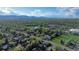 A panoramic aerial view showing a property's location in a picturesque neighborhood near a lake at 12555 W 61St Ave, Arvada, CO 80004