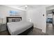 Neutral bedroom with carpet, ceiling fan and a large window providing natural light at 12555 W 61St Ave, Arvada, CO 80004