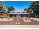 Charming two-story home with lush front yard and vibrant red garage, inviting curb appeal and plenty of space at 12555 W 61St Ave, Arvada, CO 80004