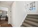 Bright staircase featuring neutral walls, clean lines, and a well-lit design, blending classic architecture with a modern aesthetic at 12555 W 61St Ave, Arvada, CO 80004