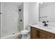 Stylish bathroom features glass-enclosed shower, modern vanity, and marble-look tile at 12635 E Pacific Cir # A, Aurora, CO 80014