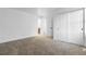 Bright and spacious bedroom with neutral carpeting, and access to bathroom and closet at 12635 E Pacific Cir # A, Aurora, CO 80014