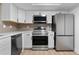 Modern kitchen showcasing stainless steel appliances and ample counter space at 12635 E Pacific Cir # A, Aurora, CO 80014
