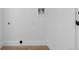 Compact laundry hook-up area with white walls and tile flooring at 12635 E Pacific Cir # A, Aurora, CO 80014
