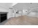 Spacious living room features a cozy fireplace and access to a sunroom or deck at 12635 E Pacific Cir # A, Aurora, CO 80014