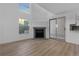 Living room featuring a fireplace, large windows, and sliding door access at 12635 E Pacific Cir # A, Aurora, CO 80014
