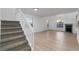 Bright living room with staircase features ample natural light and neutral flooring at 12635 E Pacific Cir # A, Aurora, CO 80014