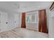 Bright bedroom with hardwood floors, white ceilings, natural light, and new curtains at 111 S Hudson St, Denver, CO 80246