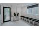 Finished basement space with access to a walkout patio, and white and black geometric tile flooring at 111 S Hudson St, Denver, CO 80246
