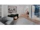 Entryway featuring hardwood floors, modern art, and access to the blue office and bathroom at 111 S Hudson St, Denver, CO 80246