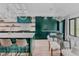 Gourmet kitchen featuring a large island, a glass top table, and green cabinetry at 111 S Hudson St, Denver, CO 80246