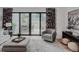 Living room with sliding glass doors to the backyard and patio, and neutral decor at 111 S Hudson St, Denver, CO 80246