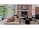 Comfortable living room with a stylish brick fireplace and lots of natural light at 111 S Hudson St, Denver, CO 80246