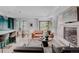 Cozy living room featuring hardwood floors, a fireplace, and an open floorplan at 111 S Hudson St, Denver, CO 80246