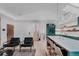 Open-concept living space with an updated kitchen island, stairs to upper level and seating area at 111 S Hudson St, Denver, CO 80246