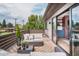 Relaxing outdoor patio featuring comfortable seating, wood decking, and seamless indoor-outdoor living at 111 S Hudson St, Denver, CO 80246