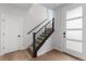 Bright entryway featuring a staircase with modern railing and hardwood floors at 14283 Currant St, Broomfield, CO 80020