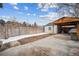 Spacious backyard with concrete patio, detached garage, and wooden fence offers privacy at 3911 Navajo St, Denver, CO 80211