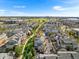 Aerial image displays townhomes in a Primary-planned community, set against a backdrop of a park and neighborhood amenities at 85 Uinta Way # 603, Denver, CO 80230