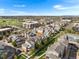 An elevated image showcases townhomes in a community with walking paths, landscaped areas, and convenient parking at 85 Uinta Way # 603, Denver, CO 80230