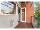 Balcony featuring wood flooring, and an exterior brick wall at 85 Uinta Way # 603, Denver, CO 80230