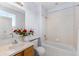 Bright bathroom with a vanity, bathtub with shower, and neutral color scheme at 85 Uinta Way # 603, Denver, CO 80230