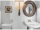 Bathroom features a modern sink, decorative mirror, lighting and neutral color scheme at 85 Uinta Way # 603, Denver, CO 80230