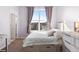 Bedroom features a storage bed, bright natural light and neutral walls at 85 Uinta Way # 603, Denver, CO 80230