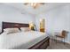 Comfortable bedroom with a dark wood bed frame, soft lighting, and neutral decor at 85 Uinta Way # 603, Denver, CO 80230