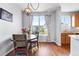 Bright dining area features a round table, wood chairs, and large window at 85 Uinta Way # 603, Denver, CO 80230