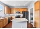 Functional kitchen featuring an island, modern appliances, and ample cabinet space at 85 Uinta Way # 603, Denver, CO 80230