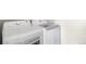 Clean laundry room with modern washer and dryer units at 85 Uinta Way # 603, Denver, CO 80230