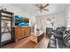 Comfortable living room with hardwood floors, fireplace, and natural light at 85 Uinta Way # 603, Denver, CO 80230