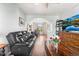 Inviting living room features a comfortable leather sofa and hardwood floors at 85 Uinta Way # 603, Denver, CO 80230