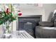 Cozy fireplace providing warmth and style in the living room with views of the table and couch at 85 Uinta Way # 603, Denver, CO 80230