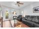 Inviting living room featuring hardwood floors, fireplace, and a comfortable leather sofa at 85 Uinta Way # 603, Denver, CO 80230