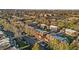 An aerial view of the neighborhood, showing mature trees, well-maintained streets, and common areas at 1272 S Crystal Way, Aurora, CO 80012