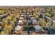The aerial view showcases a well-maintained townhome community with mature trees and manicured lawns at 1272 S Crystal Way, Aurora, CO 80012
