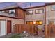 Exterior view of the back of the home with fenced-in yard and patio at 1272 S Crystal Way, Aurora, CO 80012