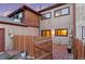Exterior view of the back of the home with fenced-in yard and patio at 1272 S Crystal Way, Aurora, CO 80012