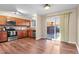 Open kitchen with wooden cabinets, stainless steel appliances and a sliding glass door at 1272 S Crystal Way, Aurora, CO 80012